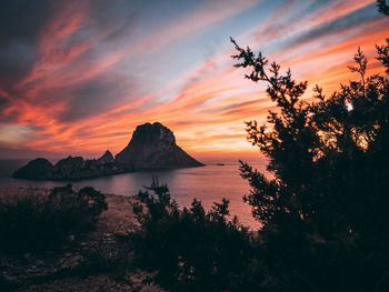 Scenic view of sea against orange sky