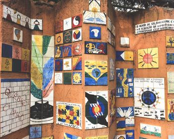 Multi colored umbrellas hanging on wall