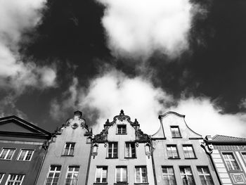 Low angle view of building against cloudy sky