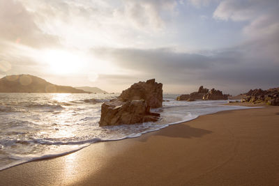 Scenic view of beach against sky