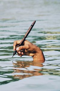 Close-up of hand holding water