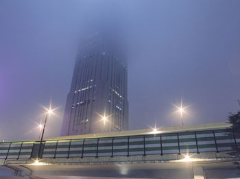 Low angle view of illuminated street light at night