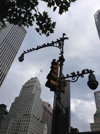 Low angle view of building against cloudy sky