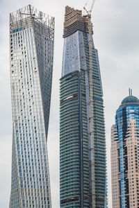 Low angle view of modern buildings against sky