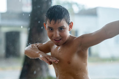 Portrait of child under the rain