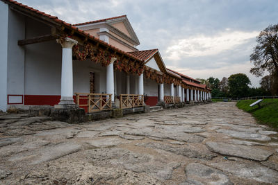 Exterior of house by building against sky