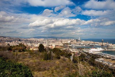 High angle view of buildings and sea against sky