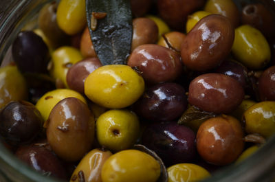 Close-up of pickled olives in jar