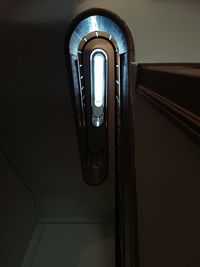 Low angle view of illuminated light on staircase at home