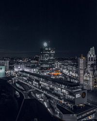 High angle view of city lit up at night