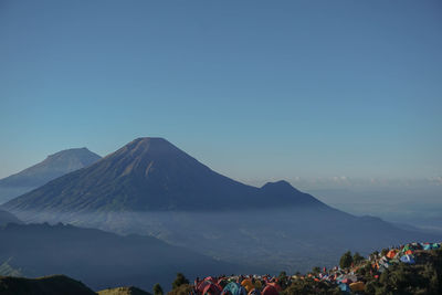 Scenic view of mountains against clear blue sky