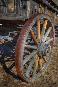 Old rusty wheel on field