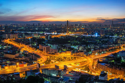 High angle view of illuminated city buildings at night