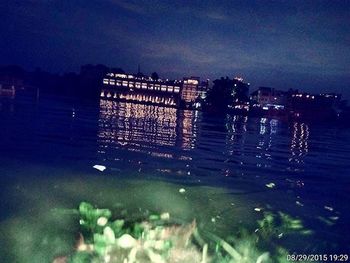 Reflection of illuminated buildings in water at night