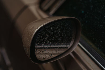 High angle view of wet side-view mirror