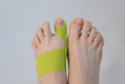 Close-up of human hand against white background