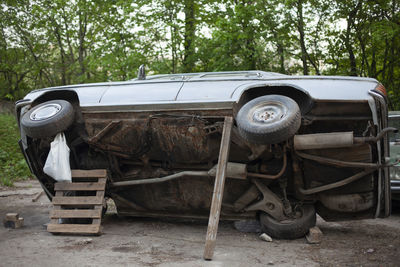 Abandoned vintage car on land