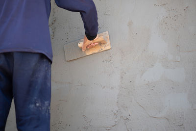 Low section of man working at construction site