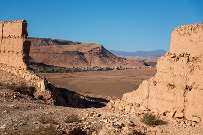 Scenic view of mountains against clear blue sky
