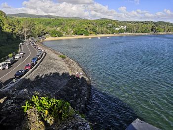 High angle view of road by sea against sky