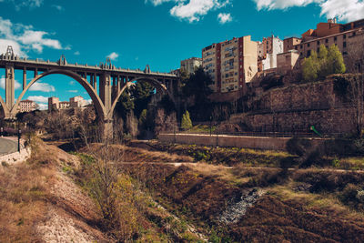 Low angle view of san jordi bridge against sky in city