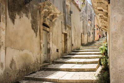 Narrow alley amidst buildings in city