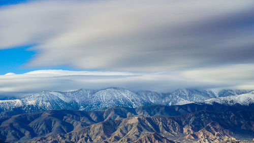 Scenic view of mountains against sky during winter