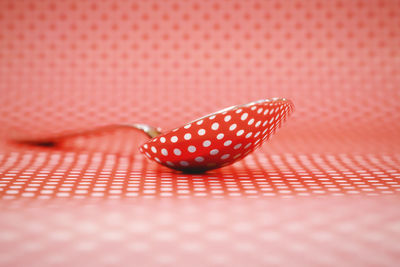 High angle view of red leaf on metal table