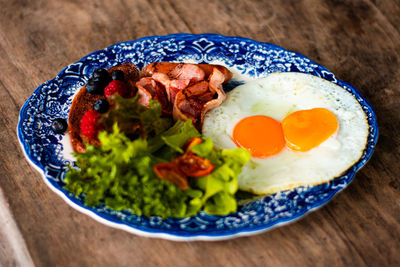 American breakfast with sunny side up eggs, bacon