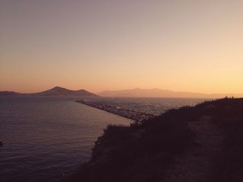 Scenic view of calm sea at sunset