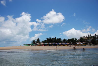 View of beach against cloudy sky