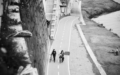 High angle view of people walking on road