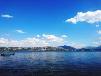 Scenic view of sea against blue sky