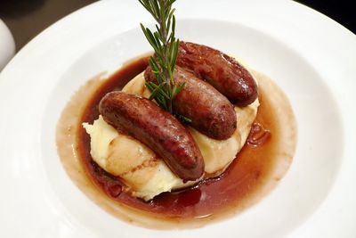 Close-up of bangers and mash served in plate