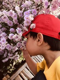 High angle view of young man with flowers