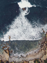 Waves splashing on rocks