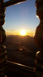 Close-up of mountains against sky during sunset