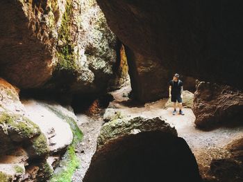 Man looking at rock formation in national park 