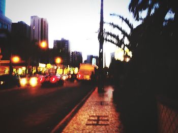 View of illuminated city at sunset