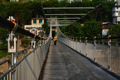 People walking on footbridge