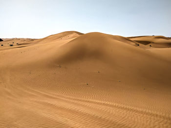 Scenic view of desert against clear sky