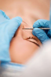 Midsection of doctor examining patient in hospital