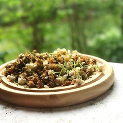 Close-up of dry flowers in plate on table