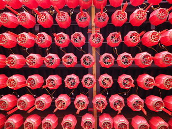 Full frame shot of red lanterns hanging from ceiling