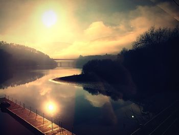 Scenic view of lake against sky during sunset