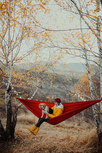 Rear view of woman in hammock