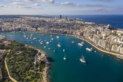 Malta, central region, sliema, aerial view of boats sailing around manoel island