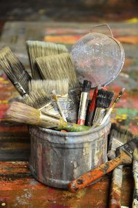 Close-up of paintbrushes on table