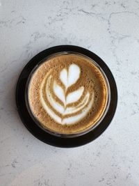 Directly above shot of cappuccino on table