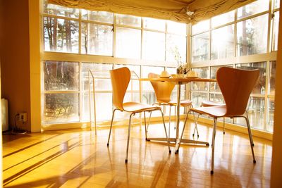 Empty chairs on table at home